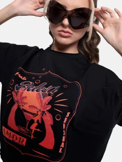 Tops & T-Shirts|T-Shirts & Tank Tops*DWD! Studioz DWD Studioz Unisex Ipanema Girl T-Shirt für Damen oder Herren Rundhals-Shirt mit großem Front-Print Schwarz