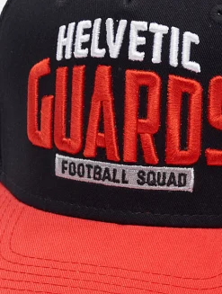 Caps & Mützen*European League Of Football Helvetic Guards Trucker Caps tiefschwarz/tomatenfarben